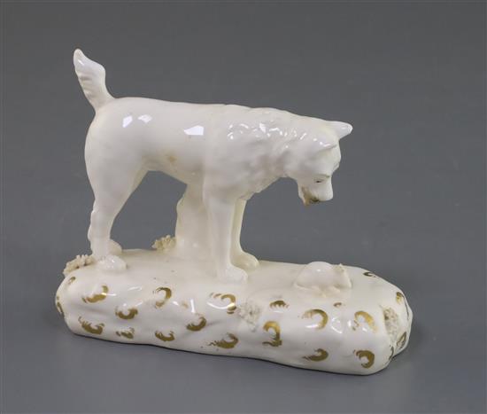 A Rockingham porcelain figure of a terrier observing a rat, c.1830, L. 12cm, fine crack